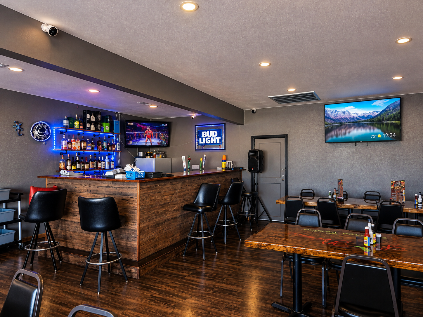 Bar at Los Primos with backlit shelves and seating